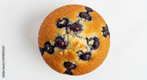 Top Down View of a Single Blueberry Muffin on a White Background with Golden Brown Crumb and Sugar Crystals