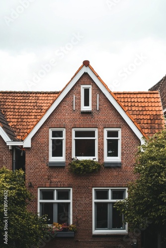 Wallpaper Mural Charming brick house with a tiled roof and flower boxes located in a peaceful neighborhood, showcasing traditional architectural style on a cloudy day Torontodigital.ca
