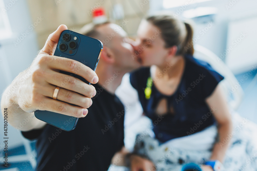 A Romantic Moment Captured in a Hospital A Couple Celebrates Their Love and Togetherness in an Unexpected Place Amidst the Challenges of Life, Showcasing Their Affection and Bonding Joy