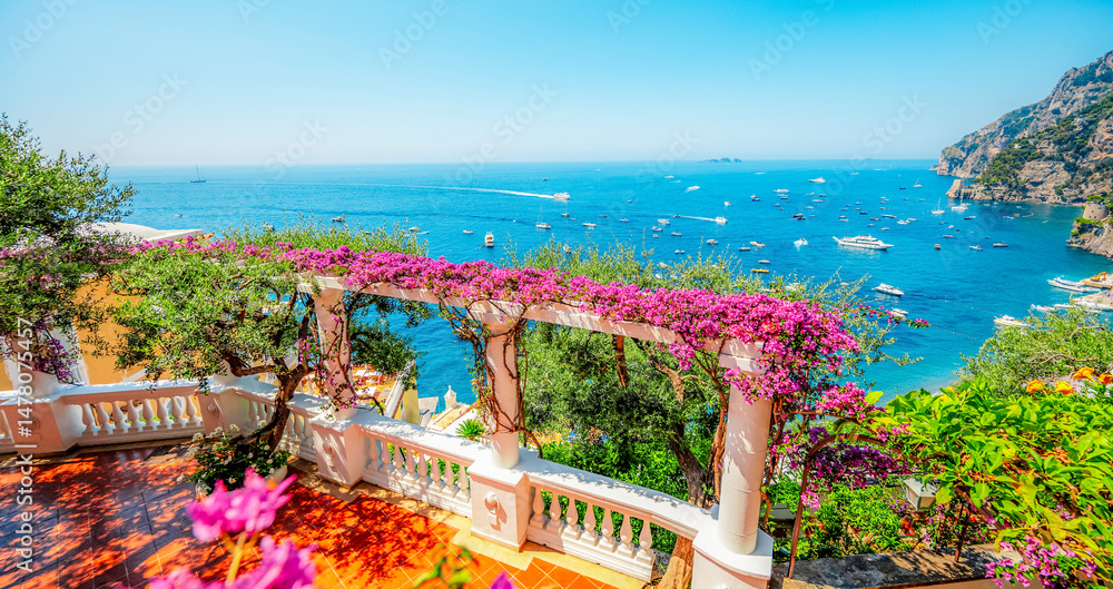 Positano coastline in south of Italy, vertiginous cliffs adorned with colorful villages, turquoise waters. Small town Positano on Amalfi Coast near Neapol, Italy