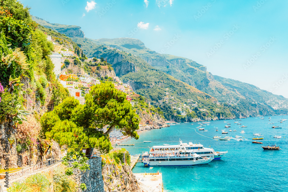 Positano coastline in south of Italy, vertiginous cliffs adorned with colorful villages, turquoise waters. Small town Positano on Amalfi Coast near Neapol, Italy