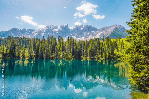 Obraz na płótnie Karersee mountain lake in the Dolomites landscape, South Tyrol alps, Italy, also known lake Carezza. Reflection green on lake. w salonie