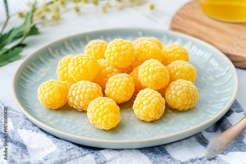 yellow raspberries with beeswax wrap on plate