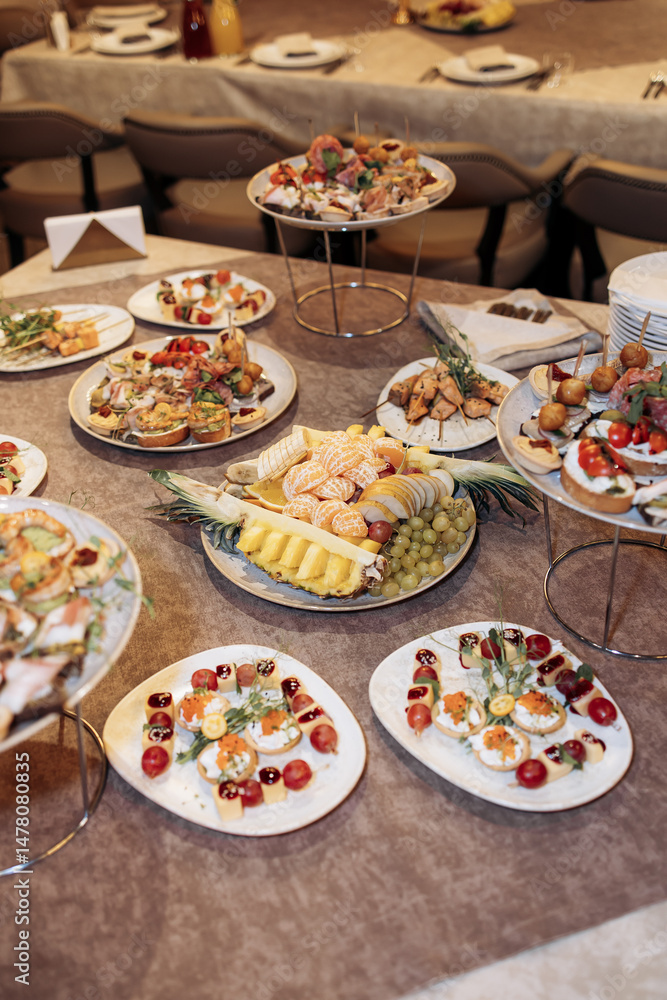 An elegant buffet spread featuring an exquisite assortment of dishes and vibrant, fresh fruits, thoughtfully curated for special events, gatherings, and joyful celebrations of all kinds