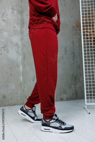 Obraz na płótnie Explore the Stylish Red Athletic Set with Comfortable Sneakers, perfect for your Active Lifestyle. This Fashionable Sportswear is ideal for the Modern Man who values comfort and style w salonie
