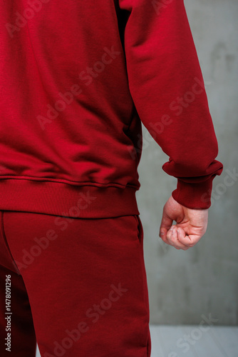Obraz na płótnie Captivating Stylish Red Sportswear A CloseUp of a Man Wearing an Athletic Tracksuit, Radiating Energy and Focused Pose, Perfectly Illustrating the Spirit of Modern Athletic Fashion w salonie