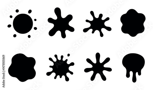 Set of eight black ink splatter symbols on white background
