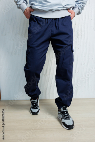 Obraz na płótnie These casual and stylish mens cargo pants paired with athletic sneakers create a trendy look that is perfect for a modern setting, combining comfort and fashion seamlessly for everyday wear w salonie