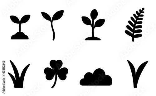 Set of silhouette plant icons: leaves, grass, sprout, clover