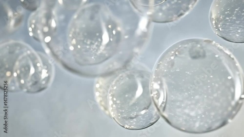 Wallpaper Mural Close up view of several clear bubbles floating on a light blue background Torontodigital.ca