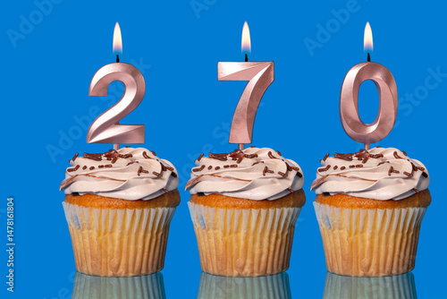 Birthday Cupcakes With Candles Lit Forming The Number 270.