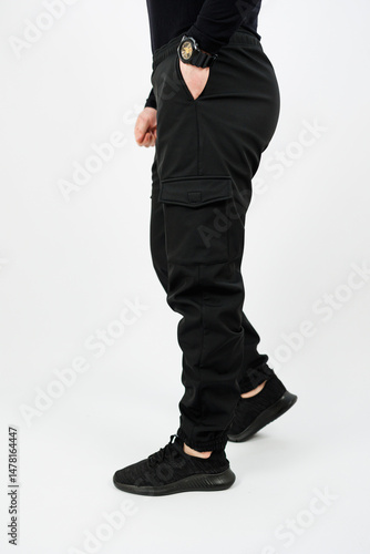 Obraz na płótnie Discover our stylish black cargo pants, designed specifically for an active lifestyle. They are great for outdoor adventures and daily wear, combining versatility with a comfortable fit youll love w salonie