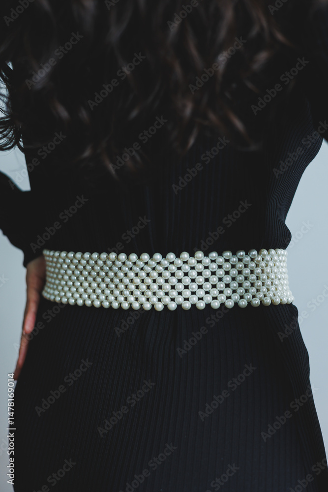 The Elegant Pearl Belt A Stylish Accessory That Perfectly Enhances and Complements a Chic Black Dress, Making It a MustHave for Any Fashionable Womans Wardrobe, Perfect for Various Occasions