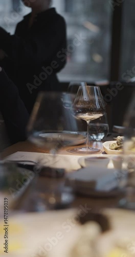 Champagne tasting, Wine glasses are on the table, stylish table setting, sparkling wine bubbles, oysters and sea urchins, special sauce