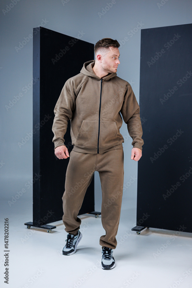 An Athletic Man is featured wearing Stylish Brown Sportswear, showcasing Modern Activewear Fashion designed specifically for Fitness Enthusiasts, Athletes, and those who love staying active