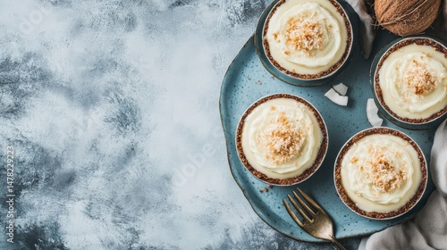 Delicious mini coconut desserts on a decorative plate with cream topping