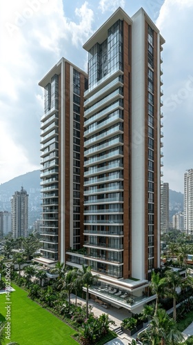 Tall twin residential buildings with balconies against cloudy sky