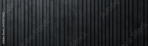 Dark textured vertical metal panels with slight variations in color and surface texture creating an industrial and modern aesthetic