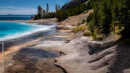Wallpaper Mural Geothermal lake with turquoise waters and mineral deposits, forested shores, and a clear blue sky backdrop on a sunny day Torontodigital.ca