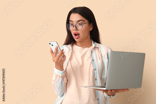 Shocked young female progra...