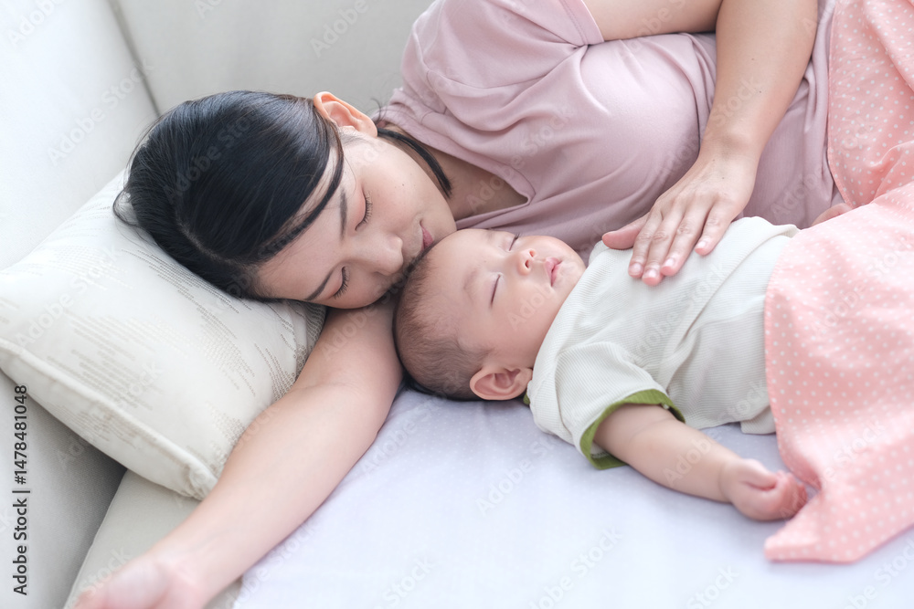 Asian woman with her son holding him by her hand. Happy asian baby boy was holding by his mother. Asian family with little boy at home enjoy tender carefree family moment, motherhood Asian woman with her son holding him by her hand. Happy asian baby boy was holding by his mother. Asian family with little boy at home enjoy tender carefree family moment, motherhood