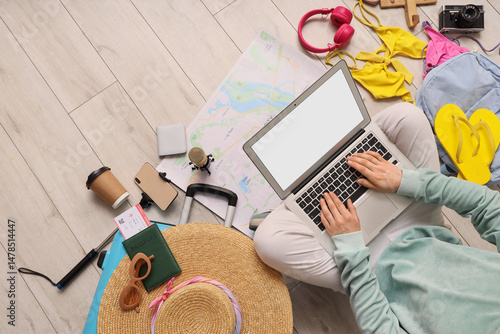 Female travel blogger using...