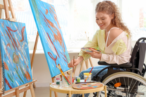 Female artist in wheelchair...