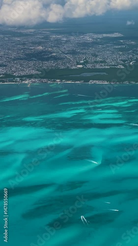 Cancun, Mexico - August 5, 2022: Video of view from the airplane window with aircraft wing, clouds, sky and land during daytime