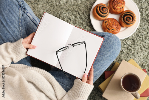 Woman with blank book, eyeg...
