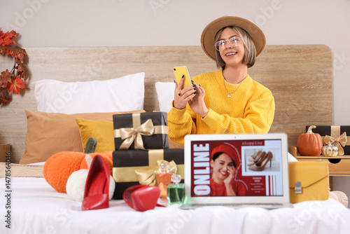 Young woman with mobile pho...