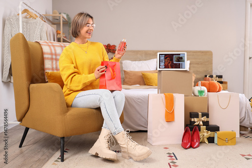 Young woman with new perfum...