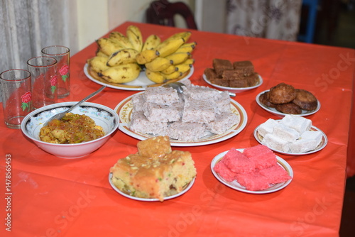 Sinhala and Hindu New Year table full of sweets. sri lanka new year traditional food table. south asian sweets food table for new year. aluth avurudu kema. Sinhala Tamil New Year Traditional Foods