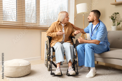 Mature woman in wheelchair ...