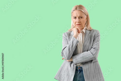 Worried mature businesswoma...