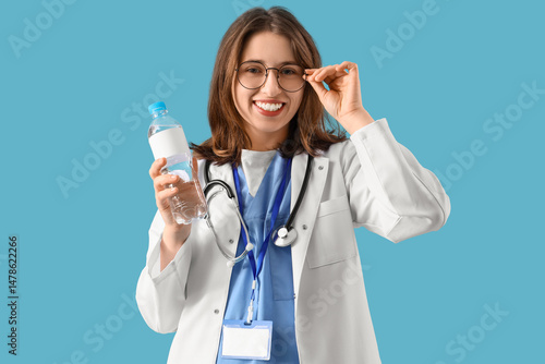 Female doctor with bottle o...