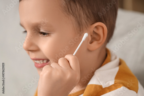 Cute little boy cleaning ea...