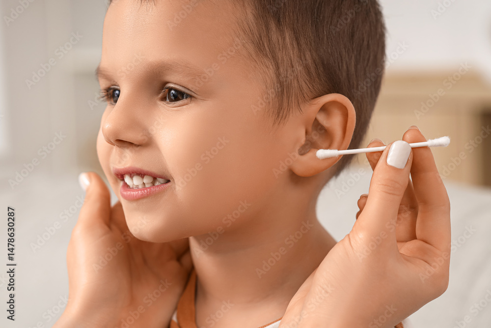 custom made wallpaper toronto digitalMother with cotton bud cleaning her little son's ears at home, closeup