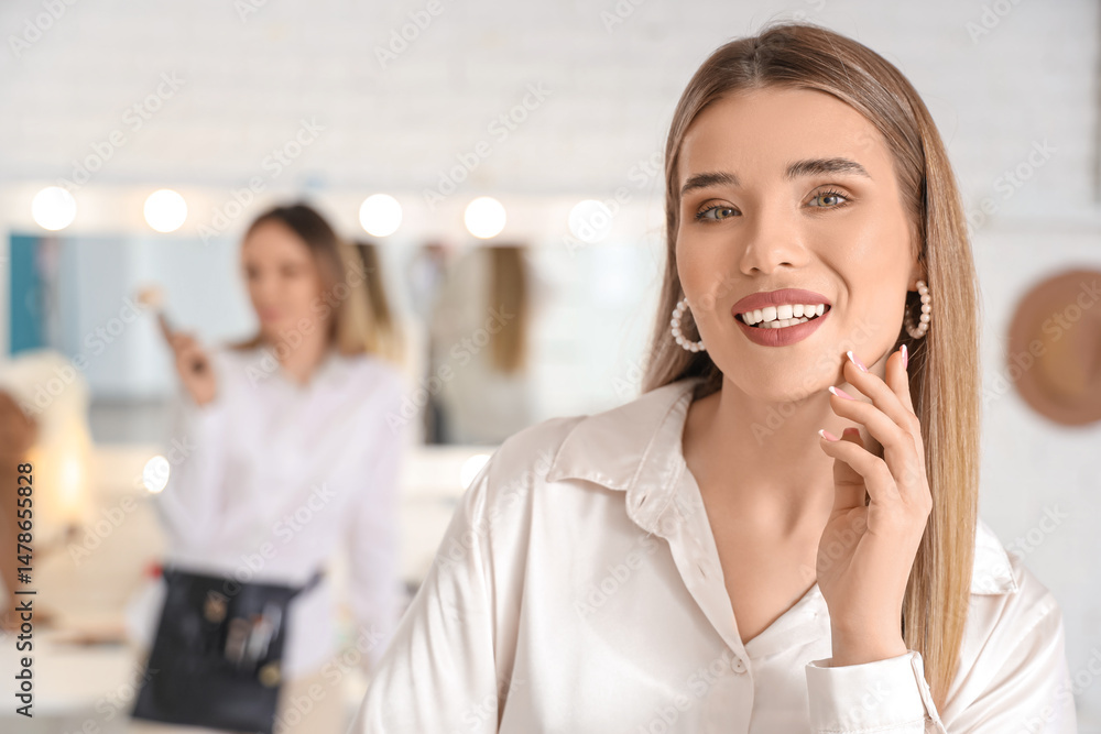 Beautiful young woman in makeup artist's studio, closeup Beautiful young woman in makeup artist's studio, closeup