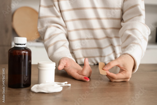 Young woman applying medica...