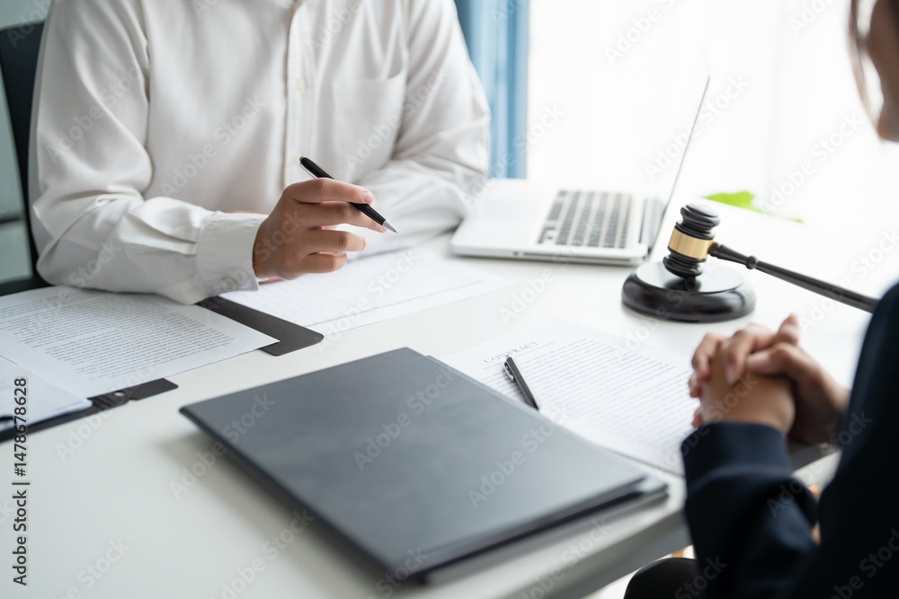 Lawyer businessman working with lawbook in office or courtroom Legal counsel with gavel and legal law. justice and lawyer concept Judge gavel hammer on Lawyer desk. Lawyer businessman working with lawbook in office or courtroom Legal counsel with gavel and legal law. justice and lawyer concept Judge gavel hammer on Lawyer desk.