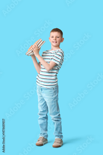 Cute little boy holding boo...