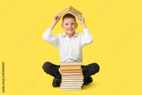 Cute little boy making roof...