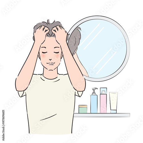 頭皮を念入りにマッサージする男性