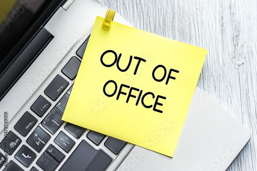 Vacation mode: Out of office message on a laptop, time to relax #1478769019