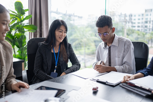 Wallpaper Mural Sales manager giving advice application form document, considering mortgage loan offer for car and house insurance. Torontodigital.ca