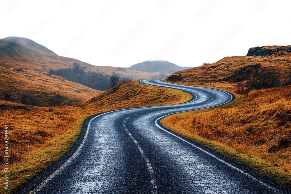 Twisting mountain road winds through golden-brown grassy hills with distant haze and cool shadows, isolated on a transparent background