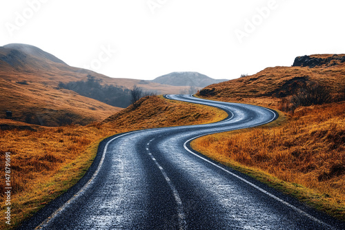 Obraz na płótnie Twisting mountain road winds through golden-brown grassy hills with distant haze and cool shadows, isolated on a transparent background w salonie