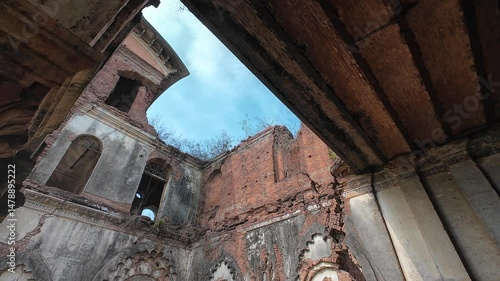 Ancient palace ruins with intricate carvings and weathered brick architecture overgrown with vegetation, Rajnagar palatial complex, Rajnagar, Bihar, India