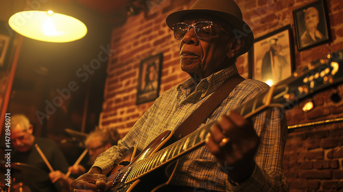 Inside a smoky blues bar during the International Blues Challenge, an aging guitarist bends over his vintage Gibson