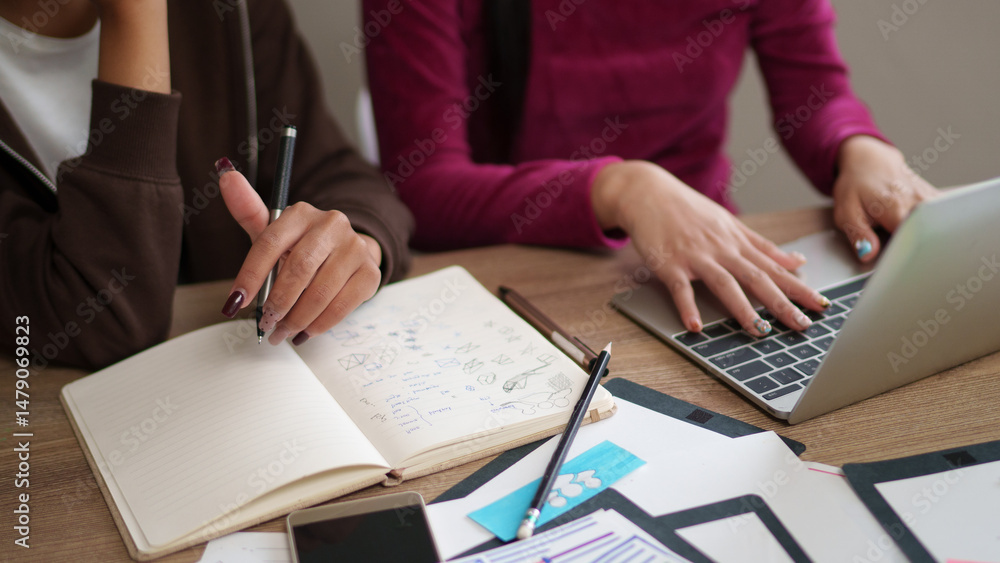 User Interface Designer Adult Asian Women Collaborate on Project Notebook Laptop Design Concept Idea Wireframe at Desk Office Workplace User Interface Designer Adult Asian Women Collaborate on Project Notebook Laptop Design Concept Idea Wireframe at Desk Office Workplace